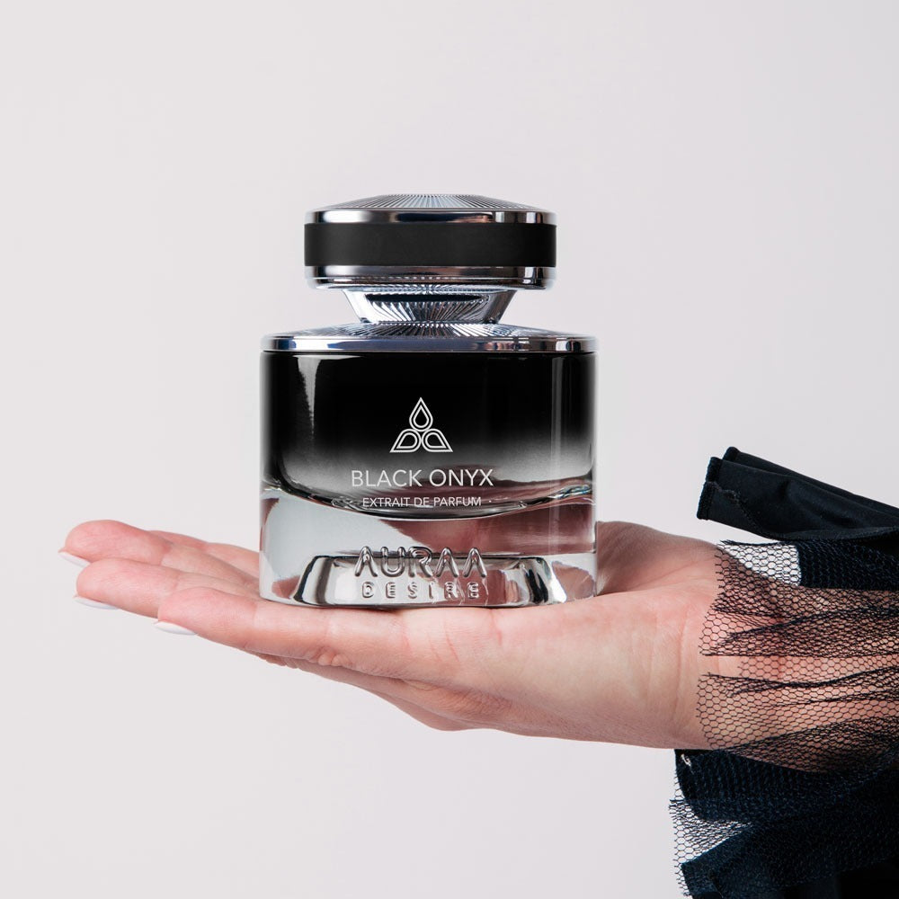 A black luxury perfume bottle from Auraa Desire by Savia Exclusive