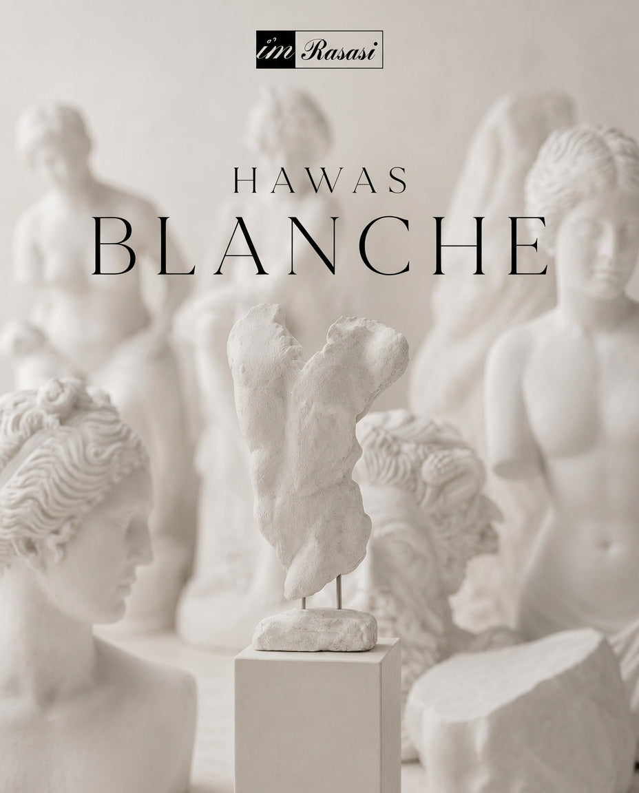 Hawas Blanche among plaster sculptures